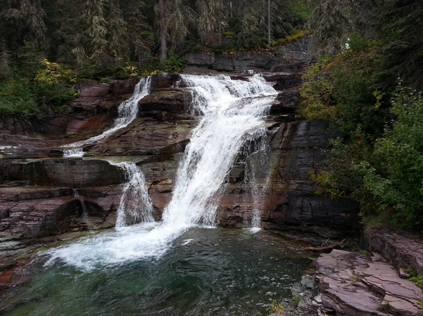 Breathtakingly beautiful waterfall Glacier national park Montana OC X