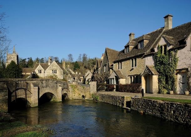 Bybrook River and Village near Castle Combe Wiltshire UK 