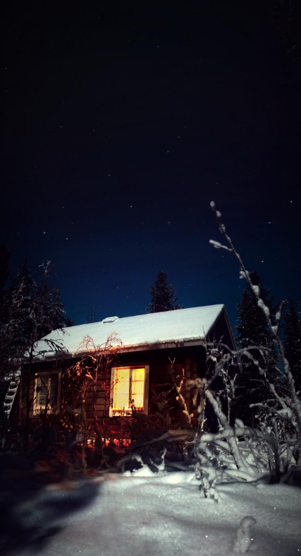 Cabin in The Cold Winter Night Lapland Finland 
