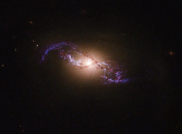 Captured by Hubble NGC  is a galaxy that is  light years across and remarkably resembles a double helix 