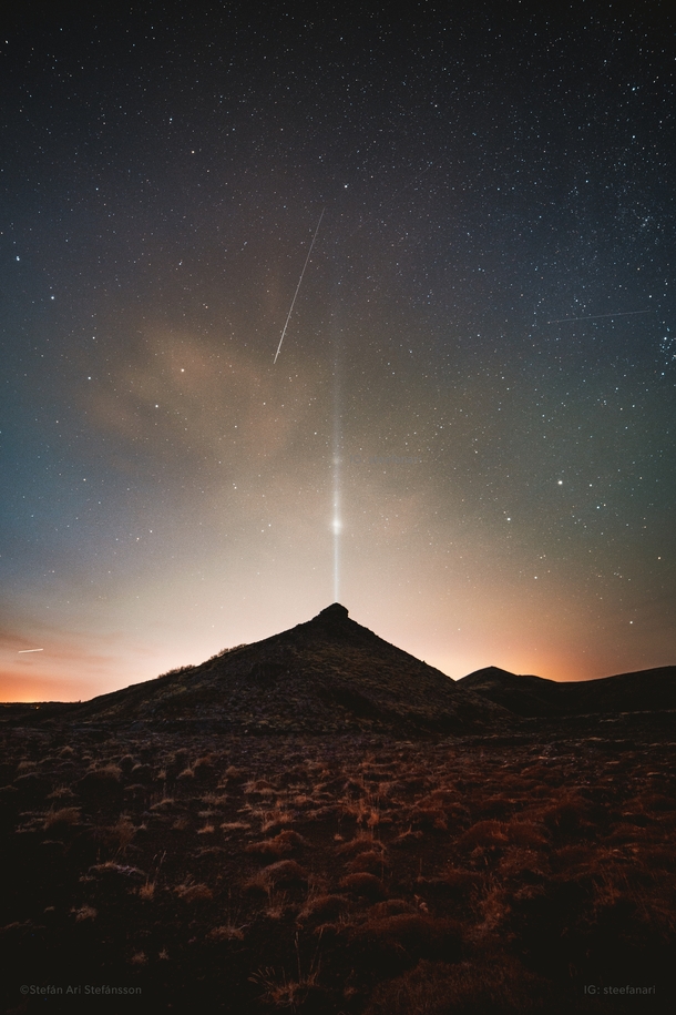 Caught a shooting star  satellites and an airplane in one shot with the Imagine Peace tower near Helgafell Iceland 