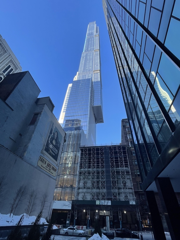 Central Park Tower on th Street NYC -the tallest residential building in the world and the tallest building outside Asia by roof height  ft The building has a cantilever extending  feet out from the right side and hangs over the neighboring building