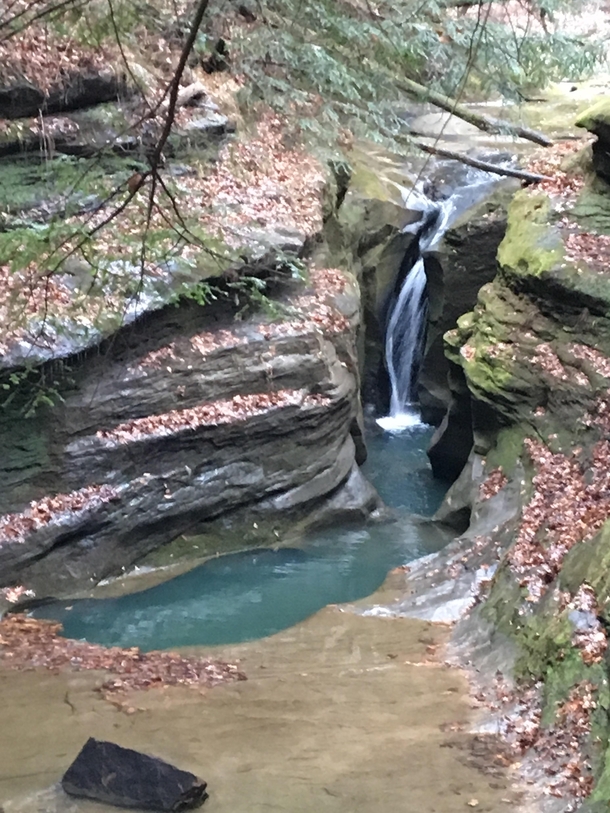 Chilly blue water lays in a scary deep water hole Hocking hills OH 
