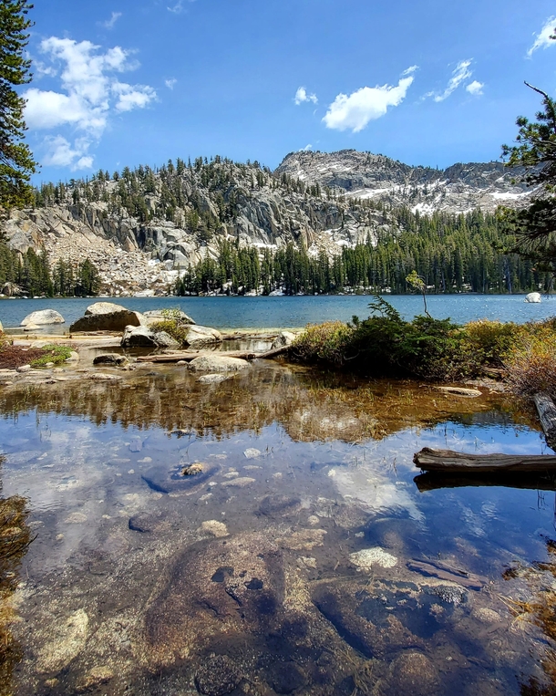 Clear water and blue skies above Sierra National Forest CA USA 