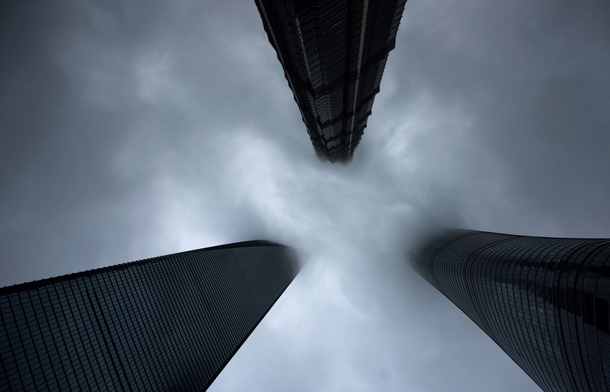 Clouds shroud the Shanghai World Financial Center the Jinmao Tower and the Shanghai Tower in Shanghai Johannes Eisele 