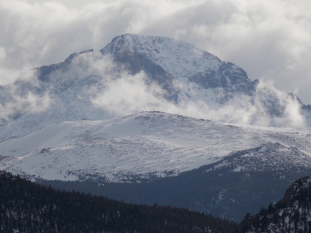 Clouds swirling around Longs Peak in Rocky Mountain National Park Colorado 