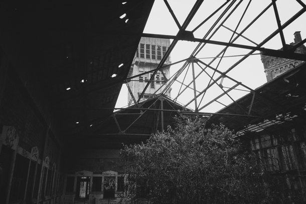 Coal mining tower trough the broken glass ceiling of an hangar  video link in description