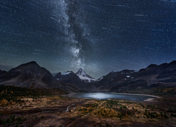 Composited starscape over Mount Assiniboine in British Columbia Canada  by Adam Gibbs