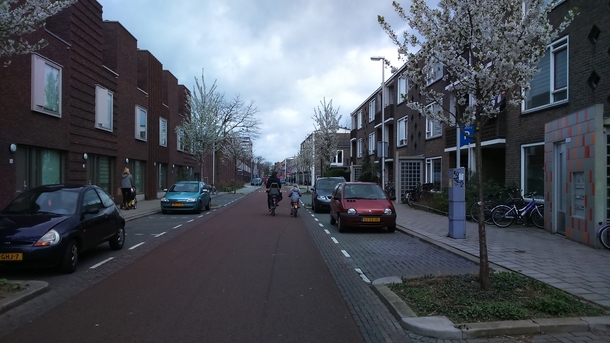 Cycling street in Utrecht the Netherlands cars are allowed but cyclists have priority 