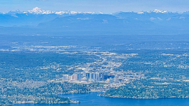 Downtown Bellevue and the wall that is the cascades from an airplane 