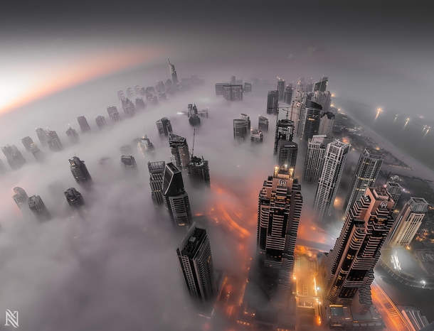 Dubai in the fog  by Karim Nafatni