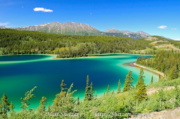 Emerald Lake in the Yukon Canada I drive by it all the time but my phone doesnt do it justice this photo by Matt Shetzer does