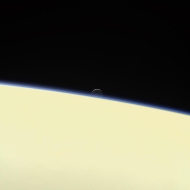 Enceladus setting over Saturn as seen by the Cassini probe in 