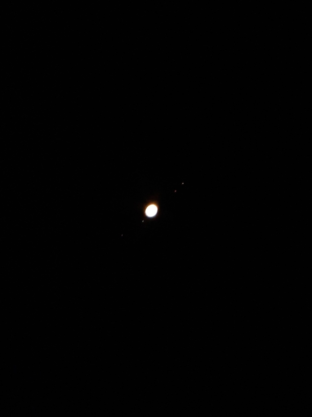 Finally got to take a picture of Jupiter and its moons Had to work with low magnification but I am still happy with how it turned out Any tips