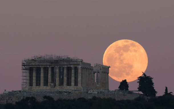 First full moon of  rises behind the majestic Parthenon of Athens