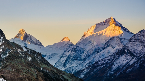 First morning light on Dent Blanche and the Matterhorn Valais Switzerland 