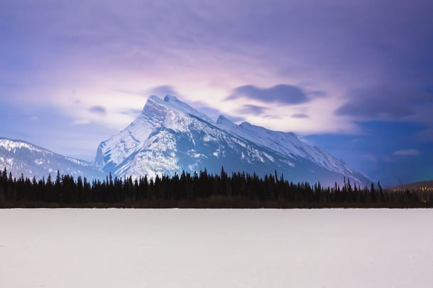 First person I showed this to asked Why isnt the bottom part of the image loading Banff lights up Mt Rundle in the Canadian Rockies Taken from Vermilion Lakes last winter 