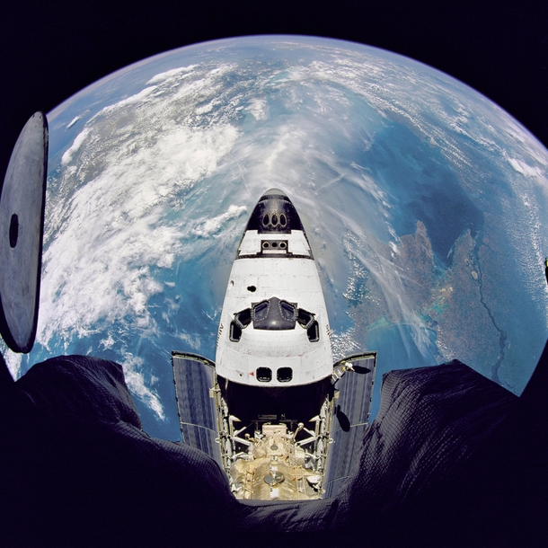Fisheye view of the Space Shuttle Atlantis as seen from the Russian Mir space station during the STS- mission June  
