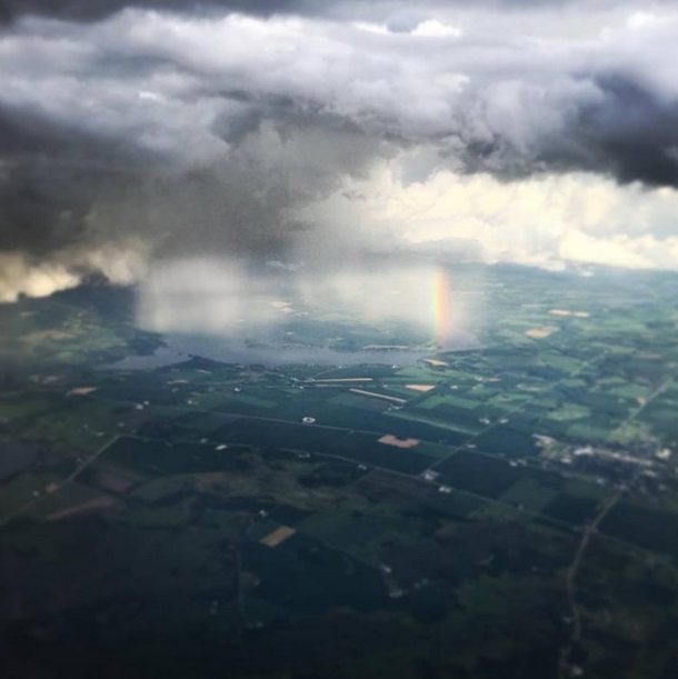 Flying into a Storm Madison WI and got this amazing shot of storm and rainbow 