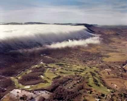 Fog bank rolling in over East River Mountain onto a local country club in my hometown Photo by Mel Grubb 