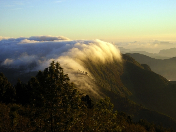 Fog rolling over the hills near Kodaikanal India 