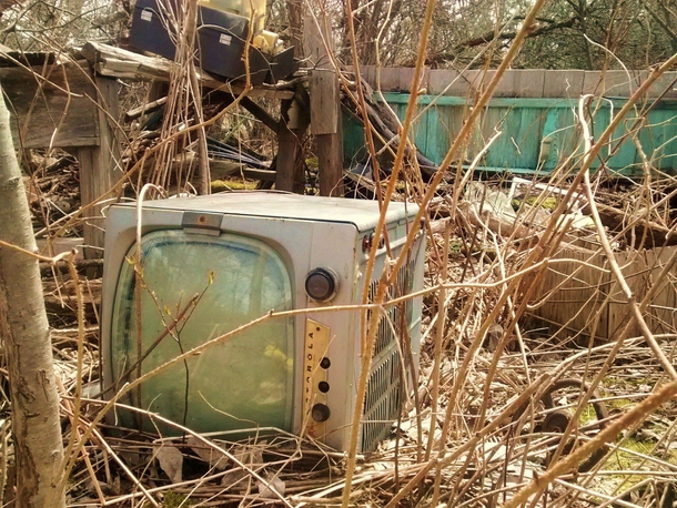 Forgotten Motorola TV in a fallen-in farm workshop 