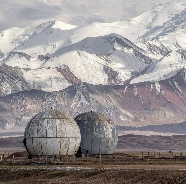 Former Soviet listening post in Sary Tash Kyrgyzstan now a refuge for sheep by Samuel Gunter 