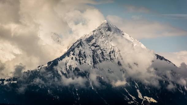 From Interlaken The Swiss Pyramid Niesen in clearing clouds 