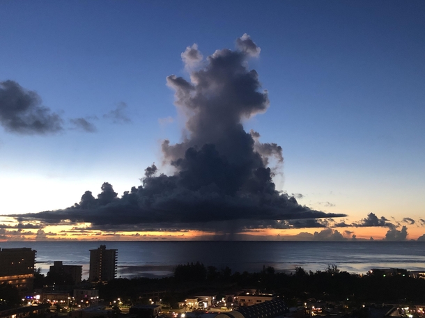Funky looking cloud floating over the ocean
