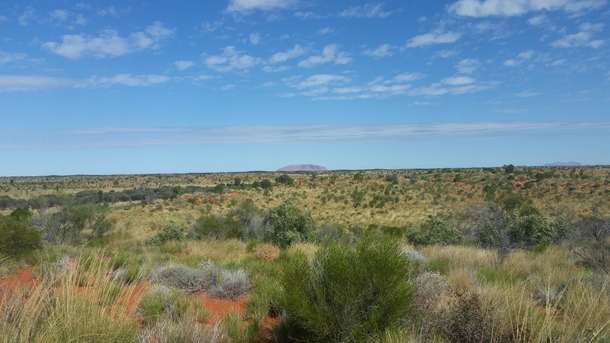 Gazing upon Uluru from across the desert NT Australia 