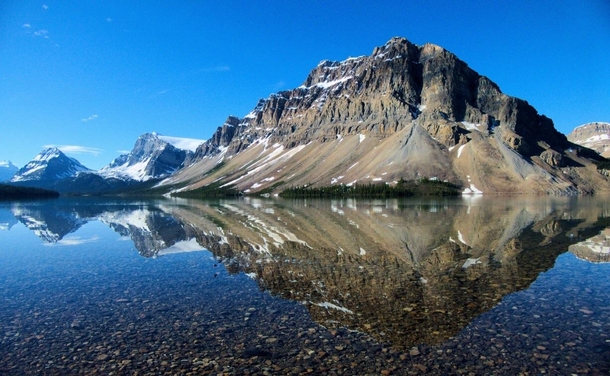 Glassy morning at bow lake just off the ice fields parkway in Alberta 