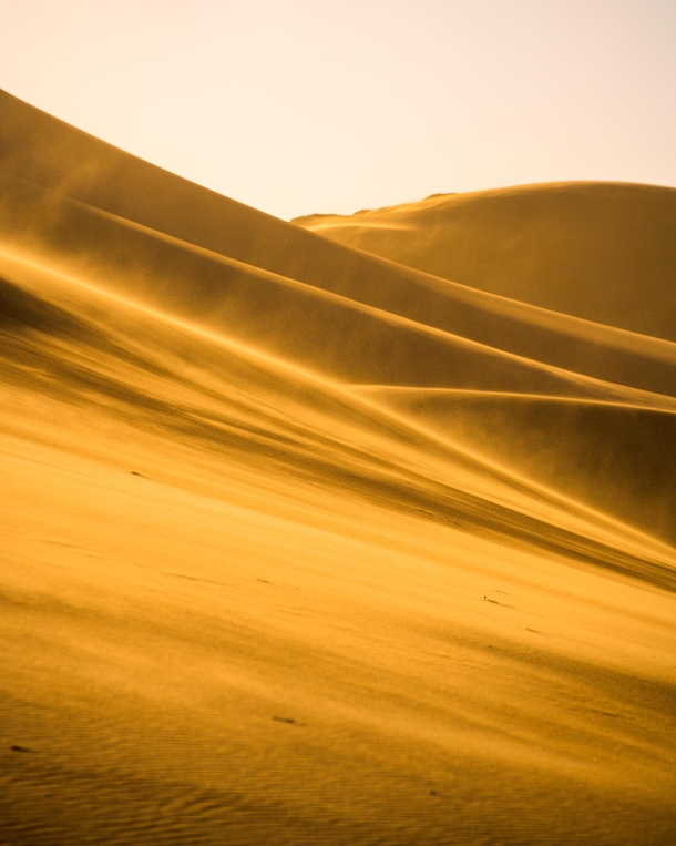 Golden dust sunset while hiking through Great Sand Dunes National Park Colorado OC x