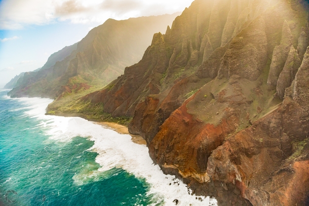 Got seat-belted into a trusty helicopter as the pilot carefully flew me over the N Pali Coast of Kauai Hawaii to take this shot 