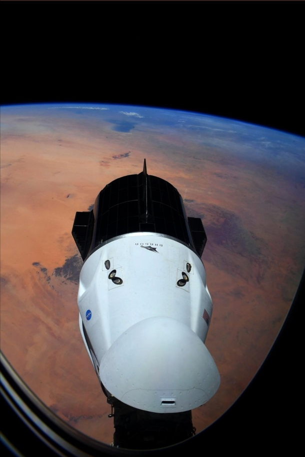 Here is a photo of Thomas Pesquet taken in the Crew- capsule with seen on their Crew Dragon Endeavor and the Earth in the background that looks like Mars