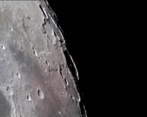 Heres an example of what is possible with a cell phone through a telescope The peak of Pythagorus Crater casting a shadow on the wall of the crater 