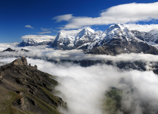 Hiked a few hours in the fog before I broke out above the clouds for this view of the Eiger Mnch and Jungfrau in Switzerland 