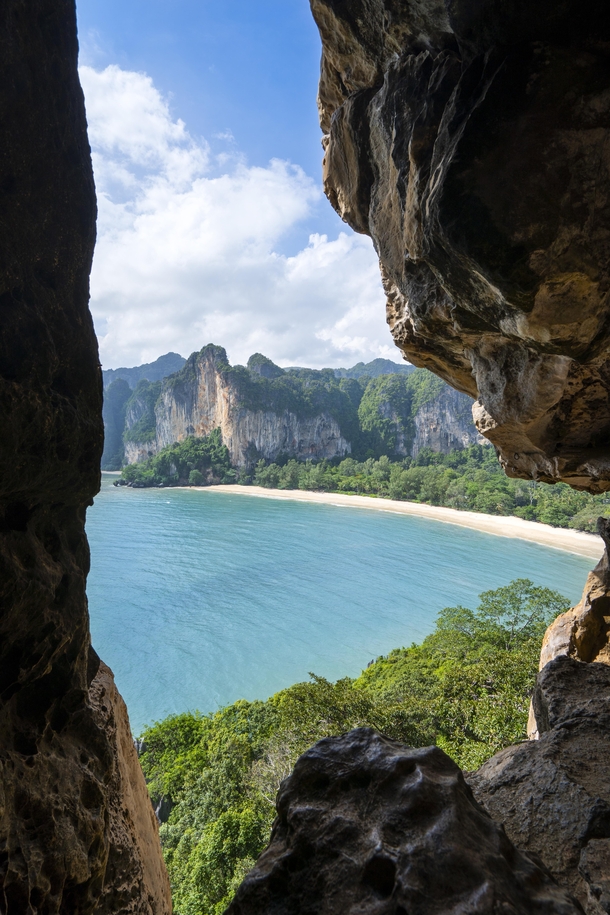 Hiked up bamboo ladders to a beautiful cave exit framing the beaches and rock formations of south Thailand 