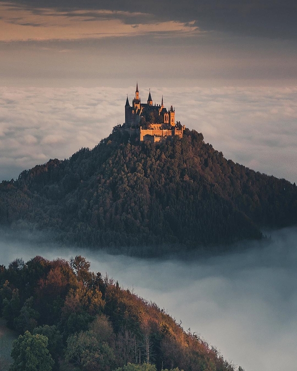 Hohenzollern Castle on a hilltop overlooking the sea of clouds in Bisingen Baden-Wrttemberg Germany