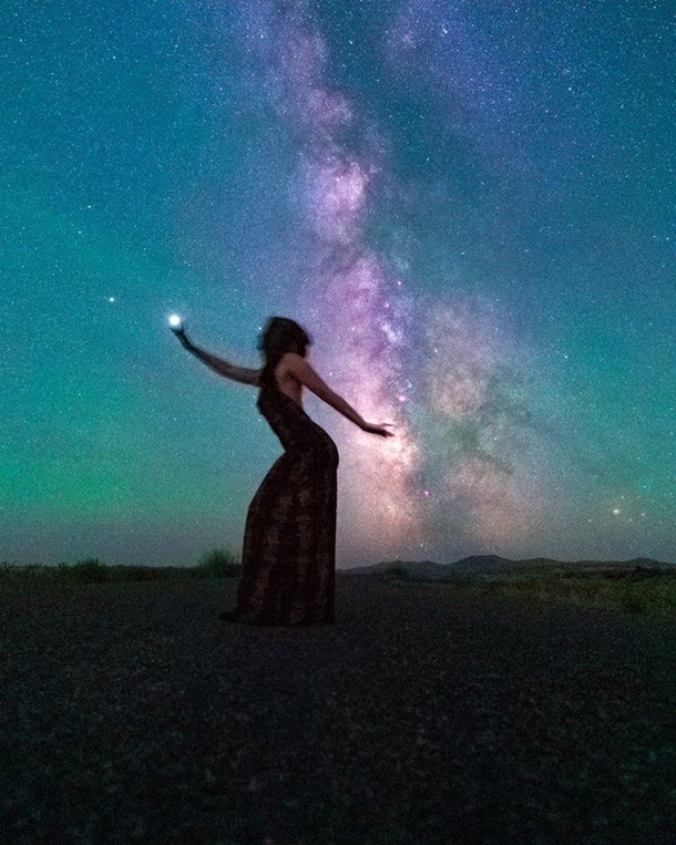Holding Jupiter in one hand stirring up cosmic energy in the other This took quite a few tries but we got it Model  Me Long exposure galaxy shot by Photographer  Jeremiah Sorells