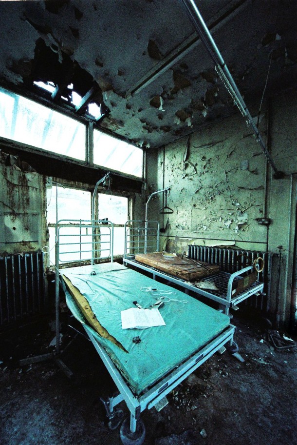 Hospital bed and peeling paint 