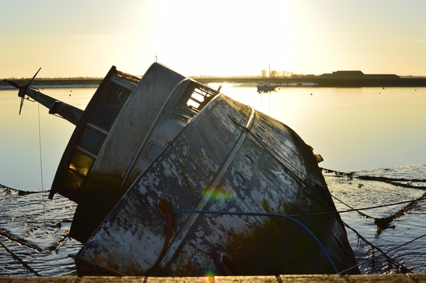 Houseboat at Burnham Quay River Crouch Essex It capsized in March  and has been left abandoned ever since Photo taken by me on th December 