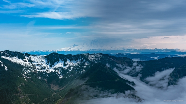 I hiked Mailbox Peak in Washington on a sunny and a cloudy day and merged two pictures of Mount Rainier 