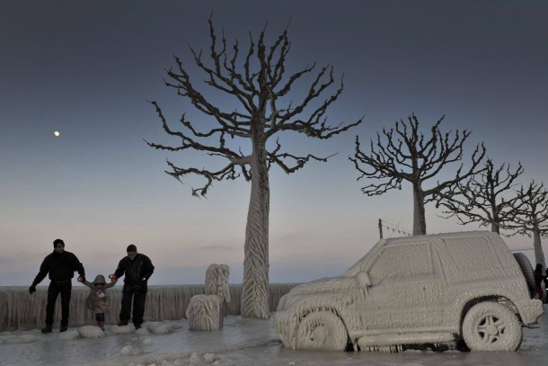 Ice covered cars and trees on the shores of Lake Geneva Switzerland 