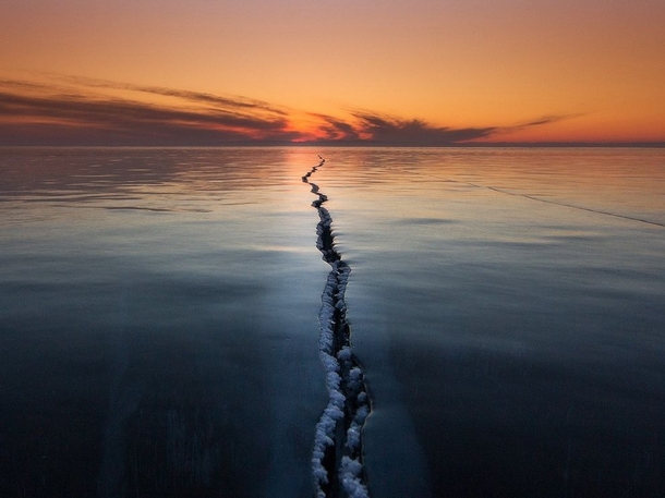 Ice on Lake Baikal is a very interesting phenomenon Ice ridges cracks tears hugging All this creates unique and fantastic stories A simple yet otherworldly shot of Lake Baikal Russia  Photo by Alexey Trofimov