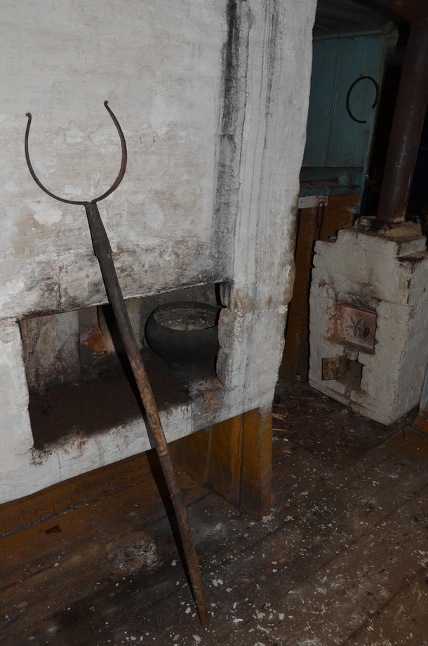 In an abandoned Russian peasant house in the village Russian stove and grasp