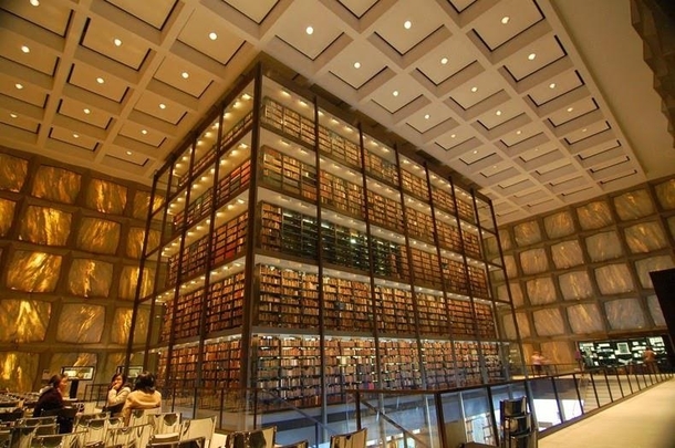 Interior of the Beinecke Rare Book and Manuscript Library at Yale New Haven CT by Gordon Bunshaft  The translucent marble walls are designed to protect the rare books from direct sunlight while still letting in natural light 