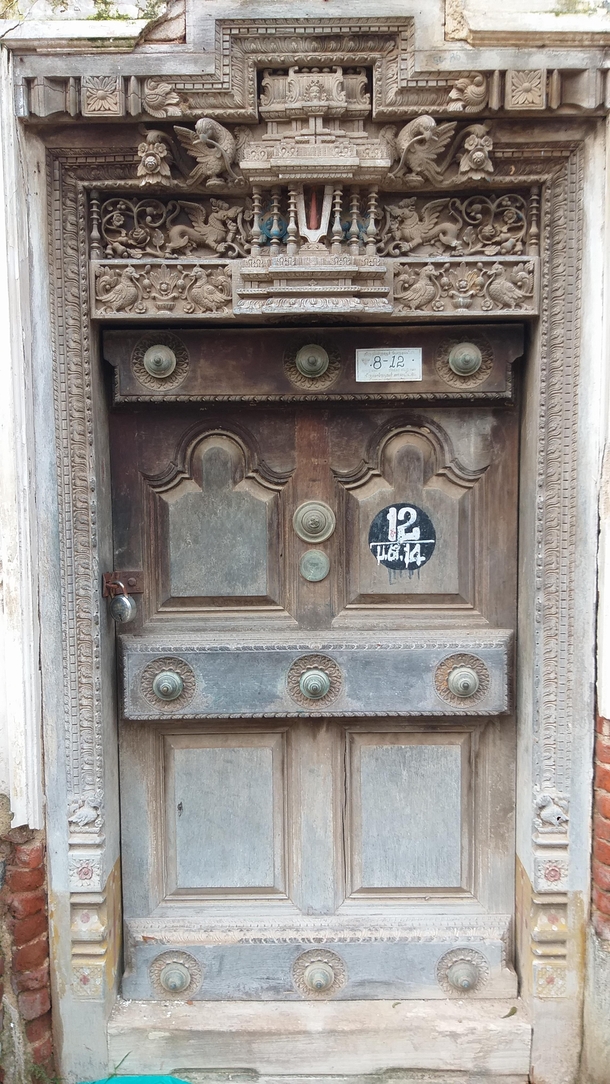 Intricately carved door of a dilapidated houselakshmi chetty kanchipuramTamil nadu India th to th century