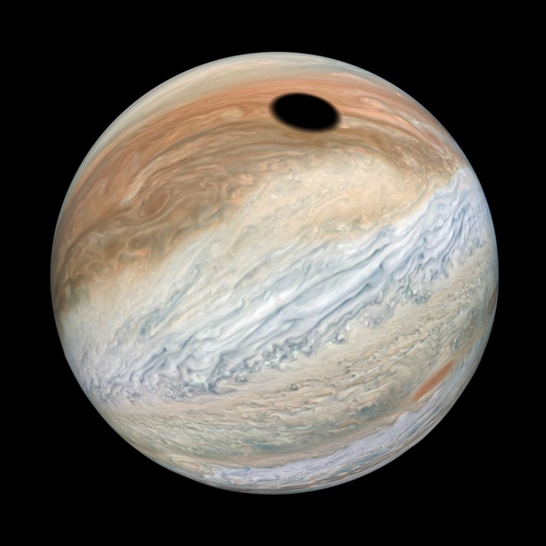 Io Casts a Shadow on Jupiter Image captured by the Juno probe and processed by Kevin Gill a NASA software engineer