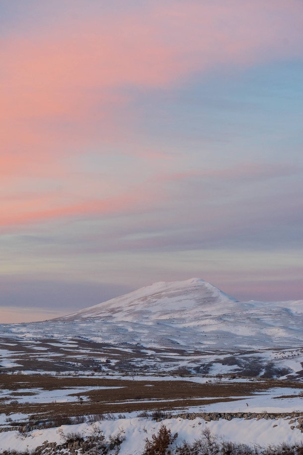 Just lovely pastel colored sky and mountain at dusk Bosnia Livno 