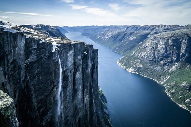 Kjerag or Kiragg is a Norwegian mountain located in Lysefjorden in Forsand municipality Ryfylke Rogaland The drop is  m  ft and it is also the site of Kjeragbolten a  m stone located between two rocks 
